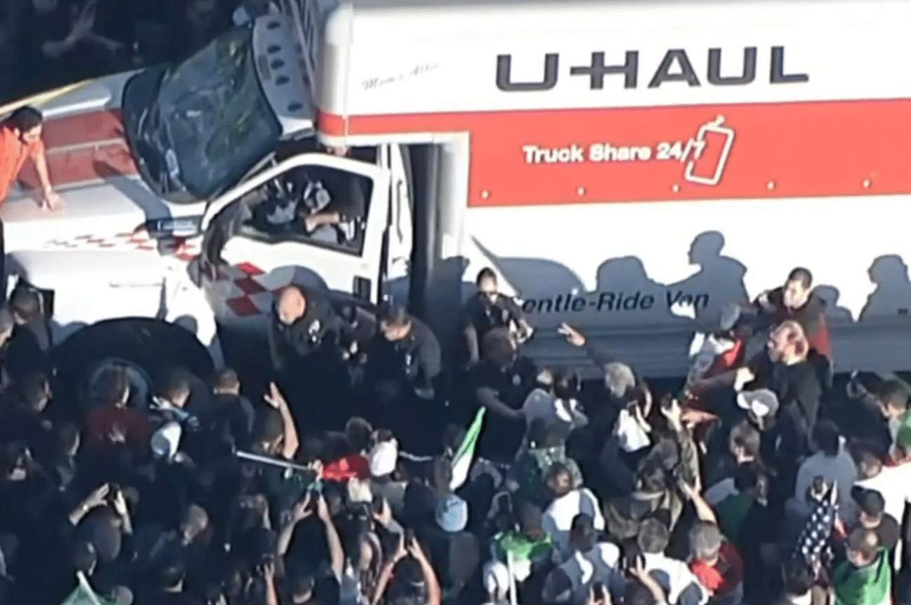 U-Haul Plows Through Iran Protest Crowd