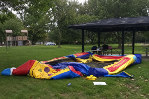 Park with deflated bouncy house via AI Image