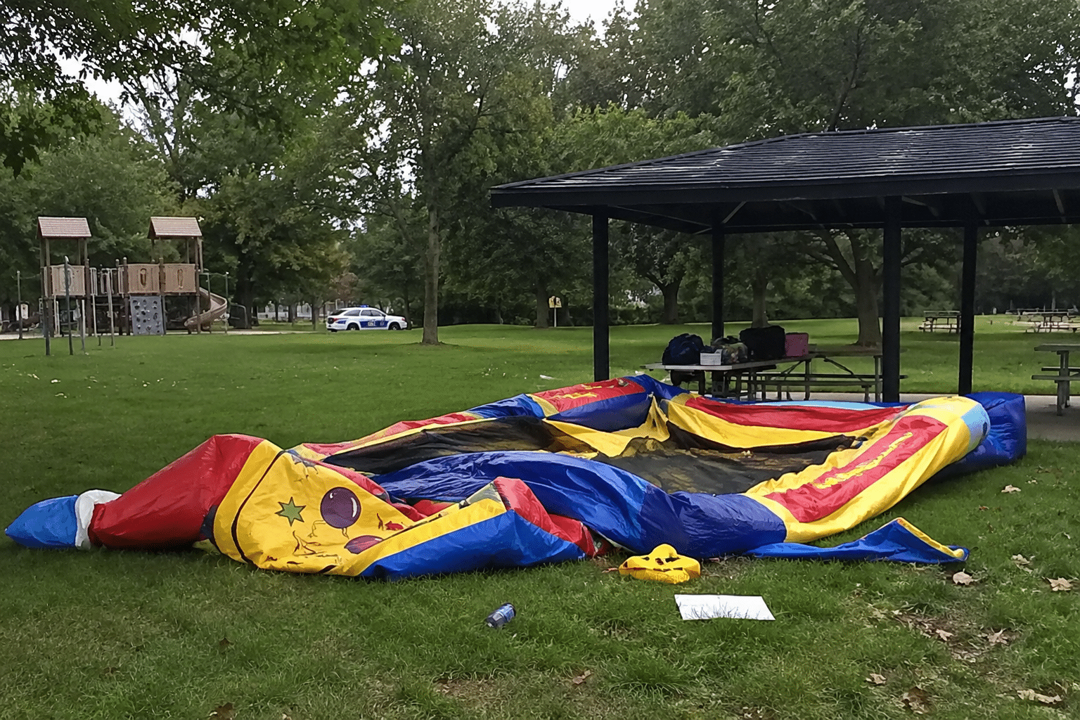 Park with deflated bouncy house via AI Image